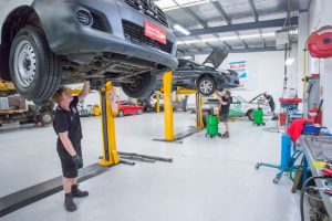 Mechanics working on commercial vehicle and fleet servicing